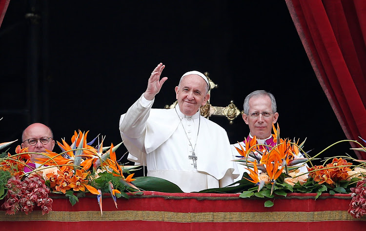 Pope Francis greets faithful after reading his "Urbi et Orbi" ("To the City and the World") message from the balcony overlooking St. Peter's Square at the Vatican on April 21 2019.