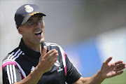 Former French football star and new coach of Real Madrid Castilla Zinedine Zidane reacts during the Spanish League B football match Real Madrid Castilla vs Atletico de Madrid at the Cerro del Espino stadium in Majadahonda, near Madrid on August 24, 2014.