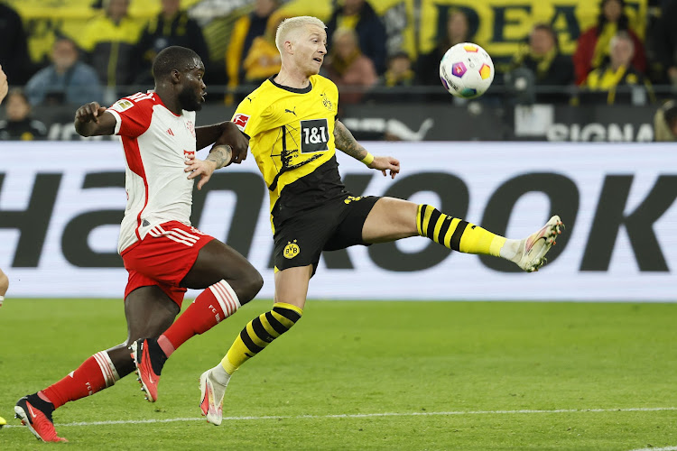 Dortmund's Marco Reus vies for the ball with Bayern Munich's Dayot Upamecano