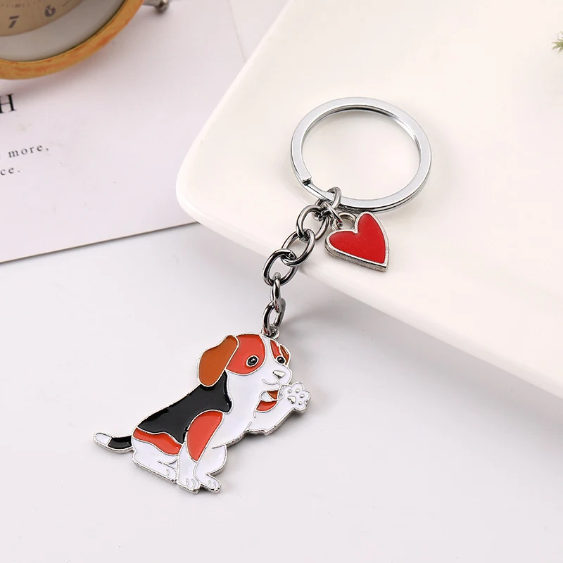 Amerikaanse schattige mode zwaaiende hond sleutelhanger hanger. Een charmant accessoire om je harige vriendje altijd bij je te hebben.