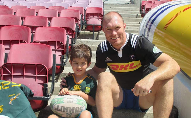 One of our competition winners, Jean Kleinhans, and his son, Ruben, at Newlands. Read more about them below.