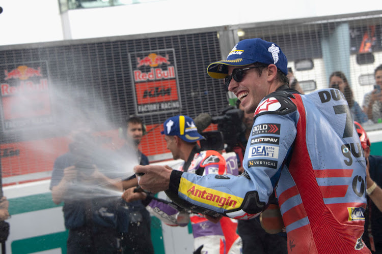 Alex Marquez celebrates the victory on track during the MotoGP of Malaysia.