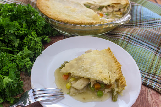 A slice of simple turkey pot pie on a plate.