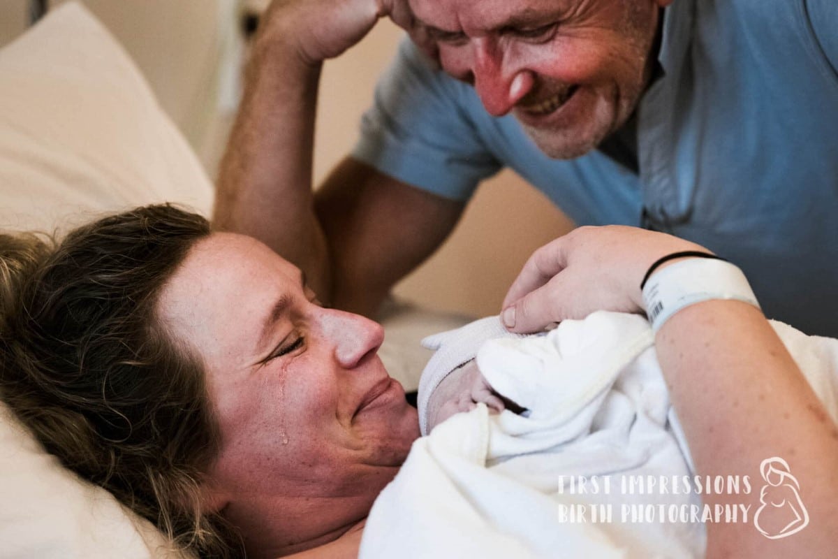 Grandfather with daughter and grandchild after birth