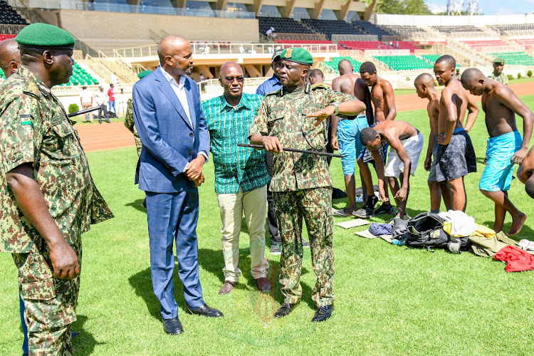 Public Service Cabinet Secretary Moses Kuria with NYS council chairperson Lt.Gen (rtd) Njuki Mwaniki and other senior officials at the Nyayo stadium in Nairobi on February 9, 2024.