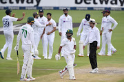 Indian players celebrate the dismissal of South Africa's Temba Bavuma during day two of the 2nd Test at the Wanderers Stadium on Tuesday. 