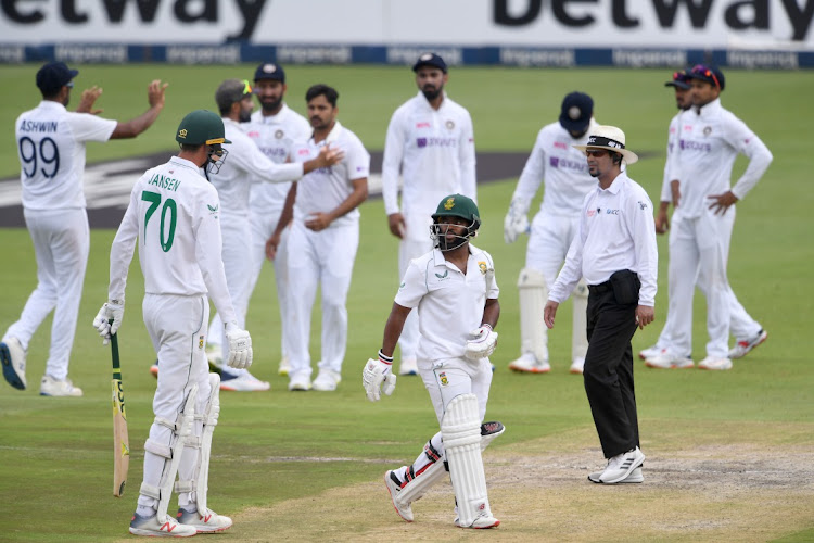 Indian players celebrate the dismissal of South Africa's Temba Bavuma during day two of the 2nd Test at the Wanderers Stadium on Tuesday.