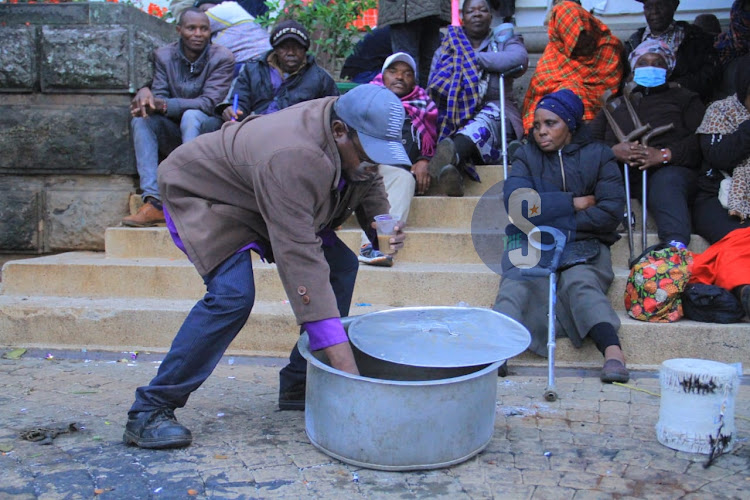 Nairobi business community of persons living with disability outside City Hall where they slept all night on November 15, 2023