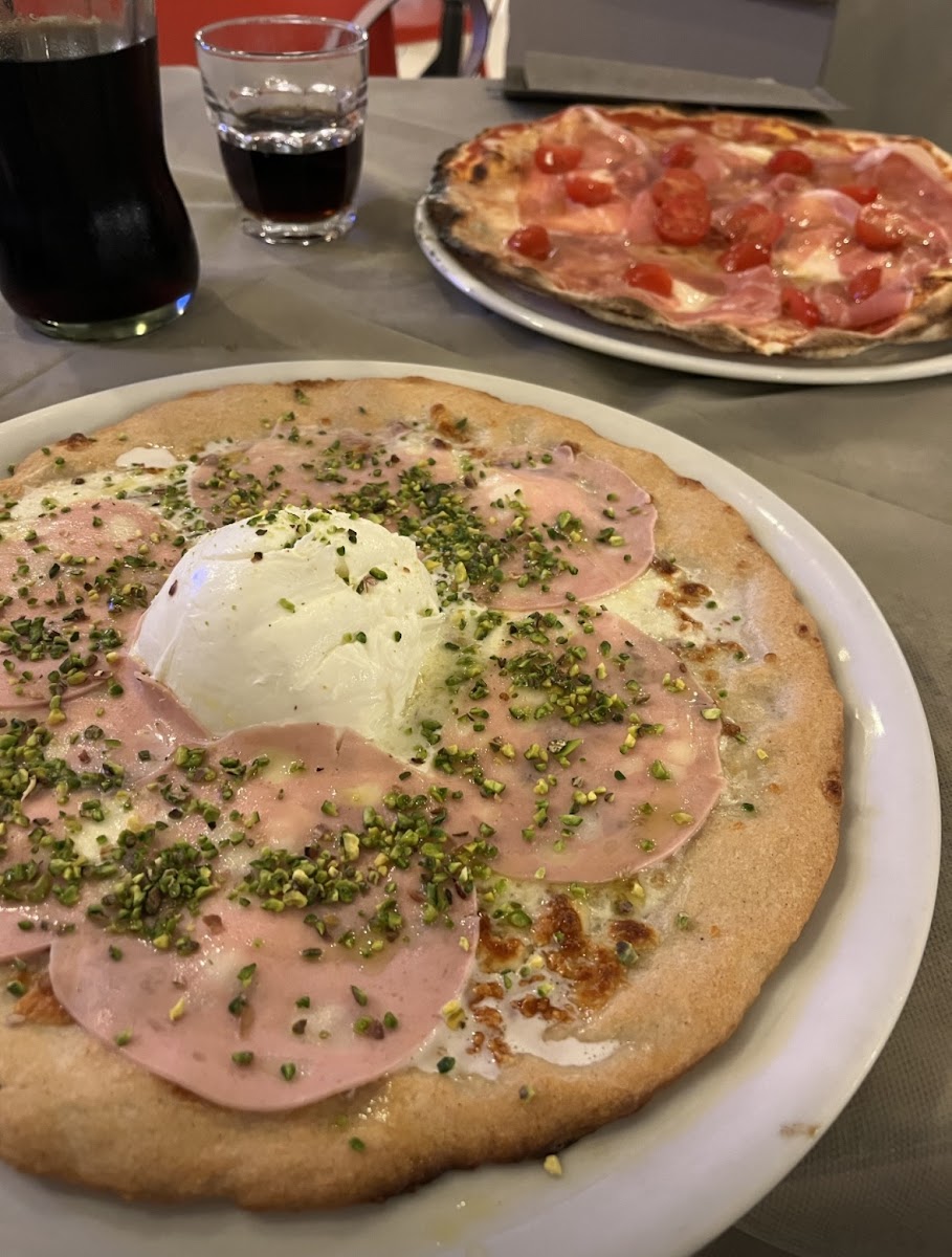 Pizza with mortadella and pistacchi