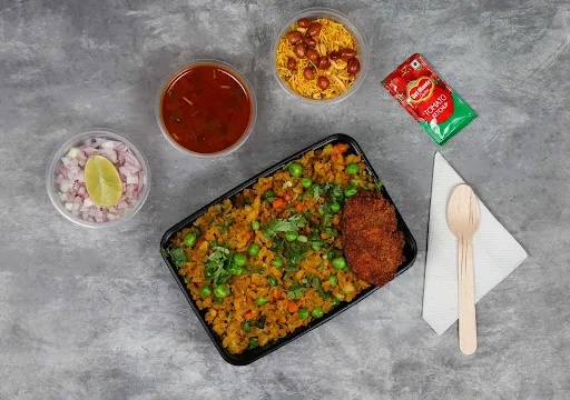 Veggies Poha With Cutlet Topped With Tari