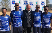 Maritzburg United head coach Ernst Middendorp poses with the club's new recruits on July 20 2021. 