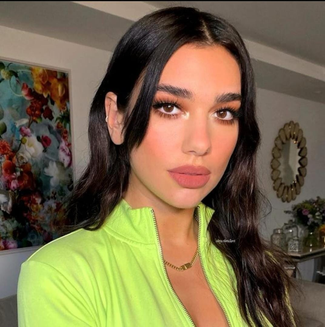 Dua Lipa wearing long hair with long bangs