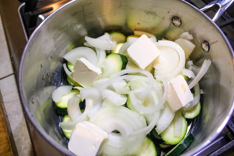 Zucchini, Butter, And Onion In A Saucepan.