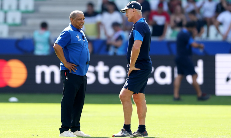 Namibia coach Allister Coetzee, left, speaks with Italy coach Kieran Crowley before the Rugby World Cup France 2023 match at Stade Geoffroy-Guichard on September 9 2023 in Saint-Etienne, France.