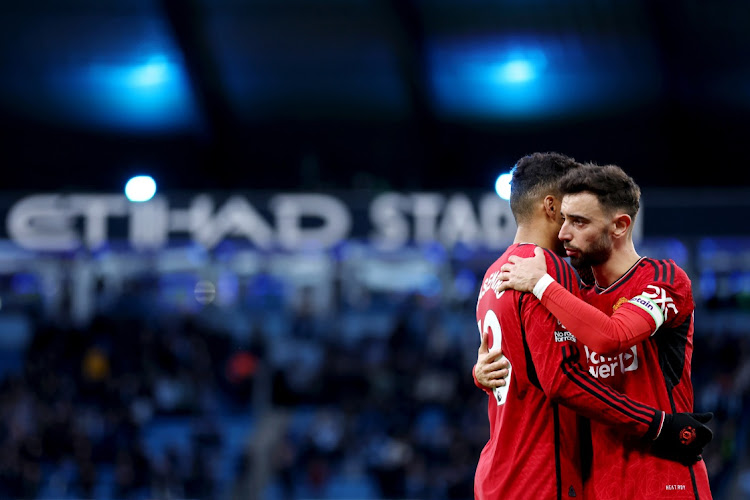 Casemiro and Bruno Fernandes of Manchester United embrace at full time after their Premier League defeat against Manchester City at Etihad Stadium on Sunday.