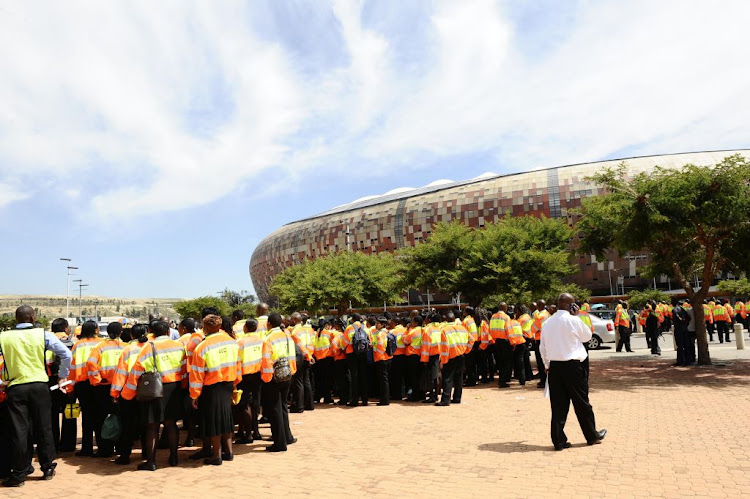 Security guards gather outside FNB Stadium in Johannesburg for a Premier Soccer League match: File photo: GALLO IMAGES/LEFTY SHIVAMBU