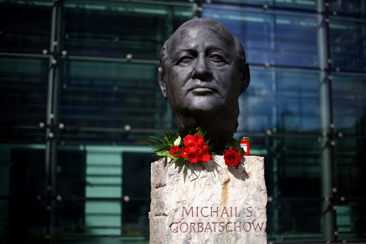 Roses are placed on a sculpture of Mikhail Gorbachev in memory of the final leader of the Soviet Union, at the "Fathers of Unity" memorial in Berlin, Germany August 31, 2022.