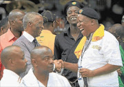 WHO's NEXT? Former president Thabo Mbeki shares a joke with Julius Malema during the ANC's centenary celebrations in Bloemfontein last month. Photo: SIMPHIWE NKWALI