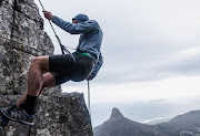 Heleen Mills climbing Table Mountain. Mills and Kelvin Trautman began running 100km non-stop to encourage Cape Town residents to adhere to the new 100 litre a day water restrictions.