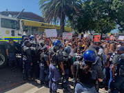 Riot police were needed to control the crowd outside Goodwood magistrate's court on February 21 2020.