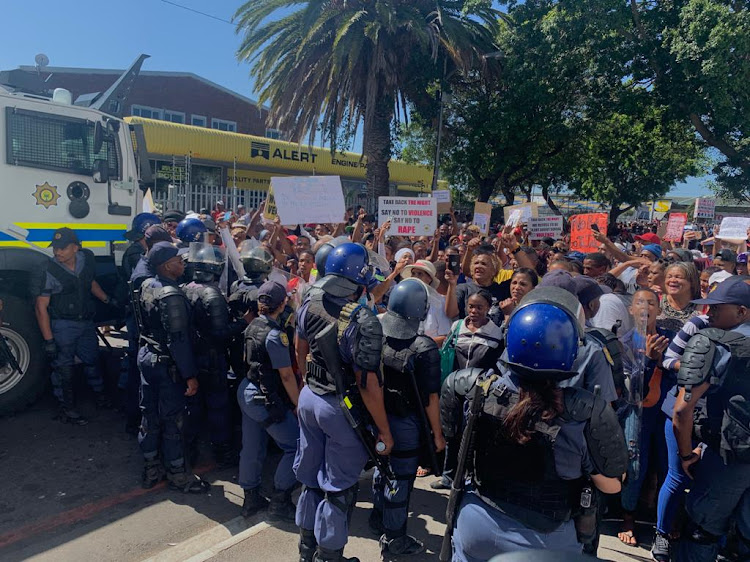 Riot police were needed to control the crowd outside Goodwood magistrate's court on February 21 2020.