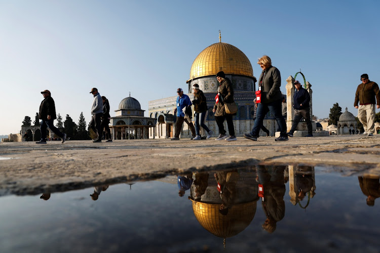 Visitors walk next to al-Aqsa mosque in Jerusalem's Old City, Israel, January 3 2023. Picture: AMMAR AWAD/REUTERS