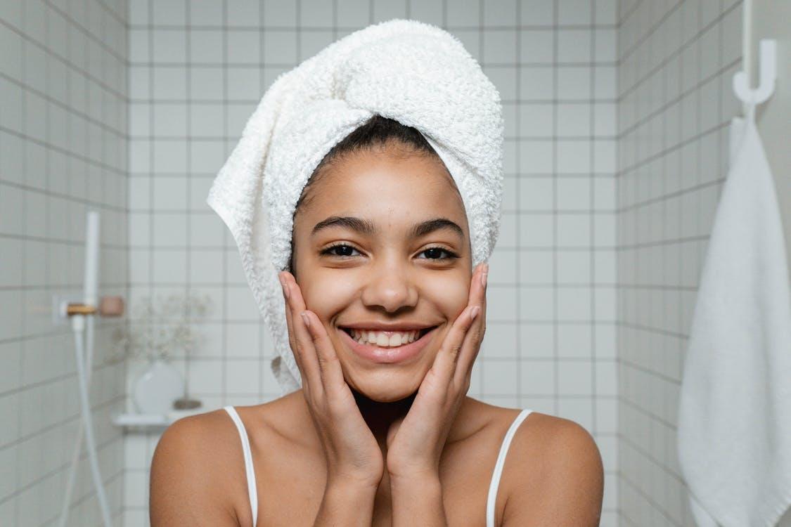 Smiling Young Woman in White Spaghetti StrapTop