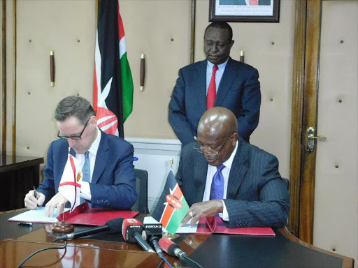 Jersey Senator Ian Gorst and Attorney General Kihara Kariuki sign the Framework for Return of Assets from Corruption and Crime Agreement between Kenya and Jersey at Harambee House on Tuesday, December 11, 2018. /COURTESY