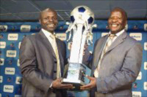 HUNGRY: Mamelodi Sundowns' assistant supporters coordinator Danieo Mudau, left, and Free State Stars publicist Louis tshakoane during the Telkom Knockout draw held at Wanderers Club, Johannesburg, yesterday. Pic.Peter Mogaki. 29/10/07. © Sowetan.