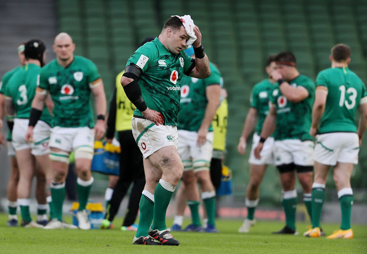 Ireland's Cian Healy leaves the pitch after sustaining a head injury during their match against France on February 14