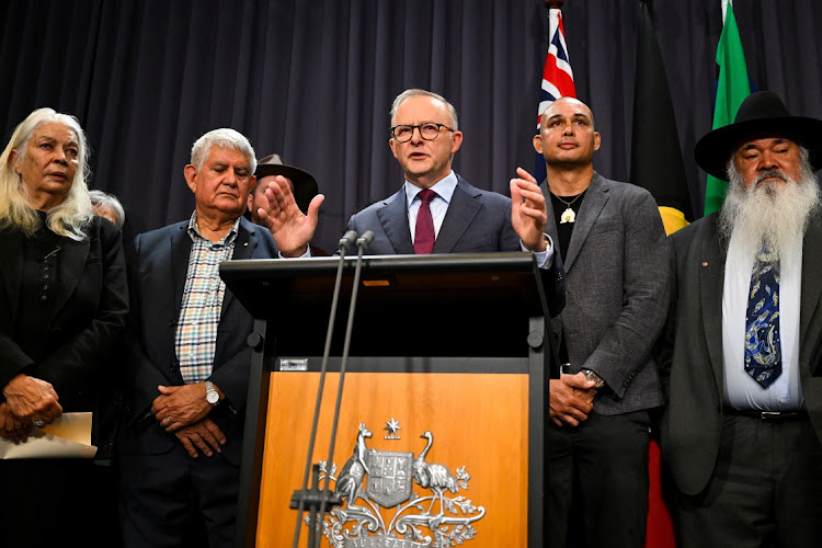 Australian Prime Minister Anthony Albanese, surrounded by members of the First Nations Referendum Working Group, speaks to the media during a news conference at Parliament House in Canberra on March 23, 2023. Picture: Lukas Coch via REUTERS