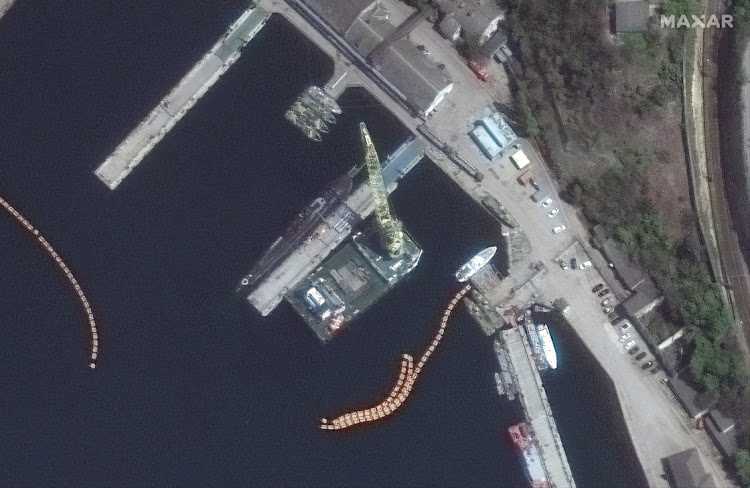 A satellite image shows loading of probable Kalibr missiles on a submarine in the Black Sea port of Sevastopol, Crimea, April 29 2022. Picture: MAXAR TECHNOLOGIES/REUTERS