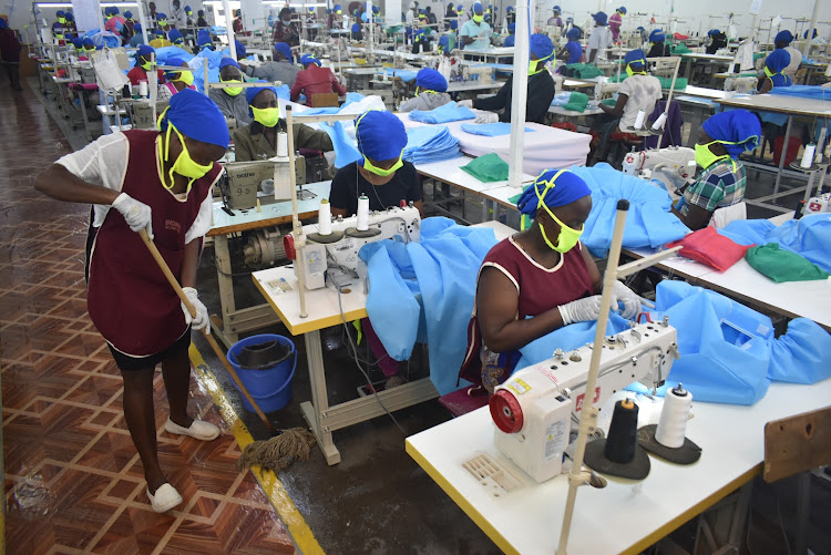 A workers cleans the production area