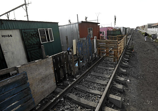 Shacks built along the (closed) railway line in Langa, Cape Town. File photo.