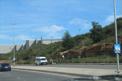 A taxi seen stopping for hitchhikers along the R61 route near the Mthatha Circus Triangle Mall yesterday(SUBS:APRIL 2;MONDAY).Picture:SIKHO NTSHOBANE