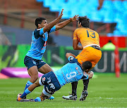 Embrose Papier of Bulls   ties down a Jaguares player at Loftus Versfeld on Saturday, in Pretoria.