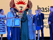 Husnaa Haffeje from Al-Falaah College in KwaZulu-Natal (third from left) and Kelly Grace Prowse from Rustenburg Girls High in the Western Cape (third from right) are the country's top matric pupils. 