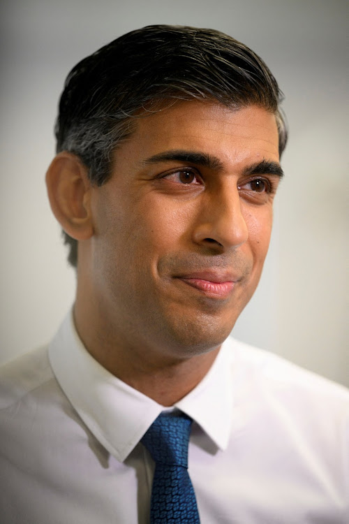 FILE PHOTO: British Prime Minister Rishi Sunak speaks with members of the media as he visits Croydon University Hospital on October 28, 2022 in London, Britain.