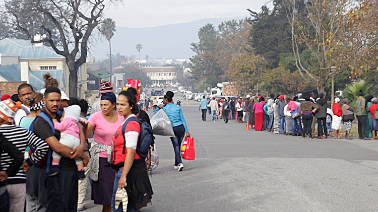 People queuing for food and clothing parcels in Knysna