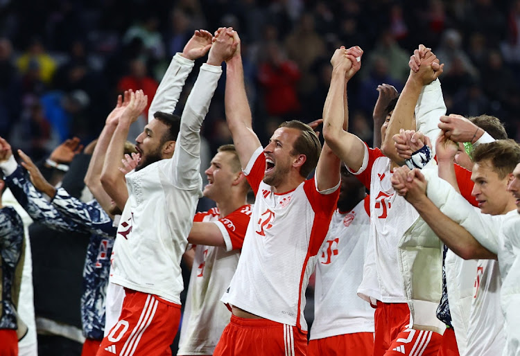 Bayern Munich's Harry Kane with teammates celebrate after the match against Arsenal at Allianz Arena in Munich, Germany, April 17 2024. Picture: REUTERS/Kai Pfaffenbach