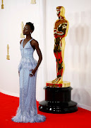 Lupita Nyong'o poses on the red carpet during the Oscars arrivals at the 96th Academy Awards in Hollywood, Los Angeles. 