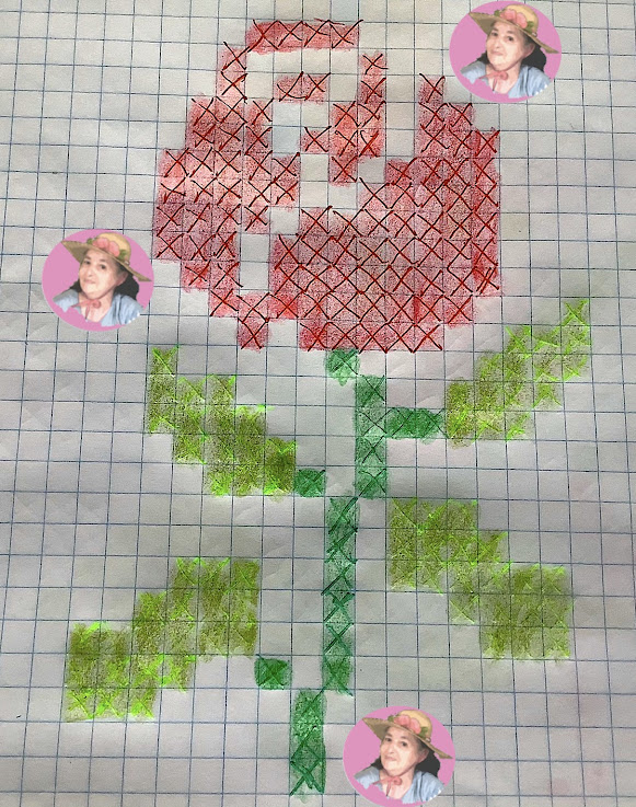 Bella muestras de rosa en un esquema en punto de cruz 