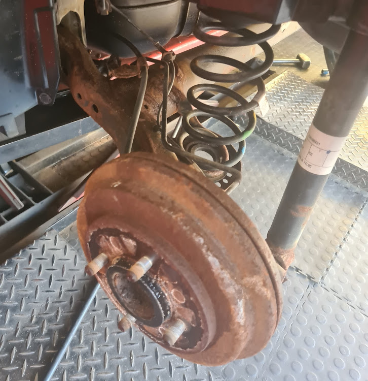 Detail of the rusted rear suspension.