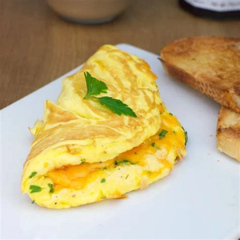 Cheese Omelette (With 2 Slices Of Garlic Bread And Potato Wedges)