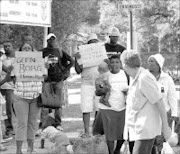 UNITED: Skielik residents want to court in great members yesterday, only to be told the case is scheduled for today. Pic. Lucky Nxumalo. 16/01/08. © Sowetan.