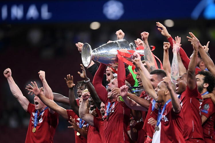 Jordan Henderson of Liverpool lifts the Champions League Trophy after winning the UEFA Champions League Final between Tottenham Hotspur and Liverpool at Estadio Wanda Metropolitano on June 01, 2019 in Madrid, Spain.