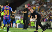 Ronald Koeman, Manager of Barcelona throws the ball to Sergi Roberto of Barcelona during the UEFA Champions League group E match between FC Barcelona and Bayern Muenchen at Camp Nou on September 14, 2021 in Barcelona, Spain.