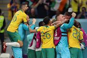 Australia players celebrate after Mathew Leckie scored to give the side a 1-0 lead during the Fifa World Cup Qatar 2022 Group D match against Denmark at Al Janoub Stadium on November 30 2022 in Al Wakrah.