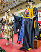 Njabulo Ntombela, 27, surprises his great-grandmother Nomkikilizo Ntombela, 89, by bestowing his law degree on her.