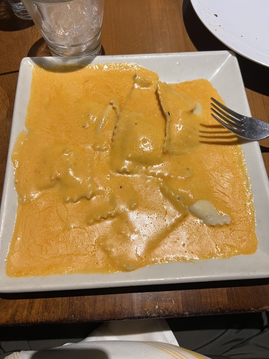 Cheese ravioli with pink sauce